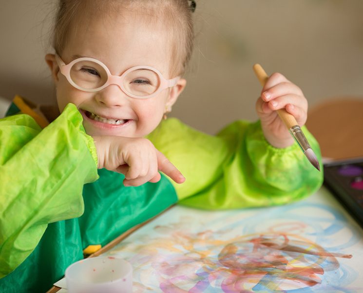 Girl with Down syndrome draws paints